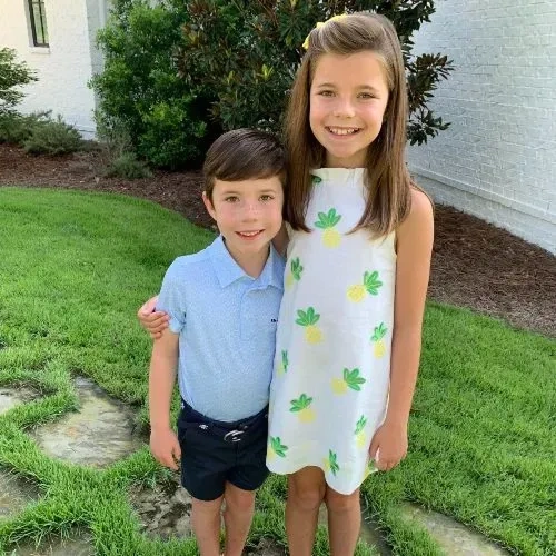 Children smiling outdoors together