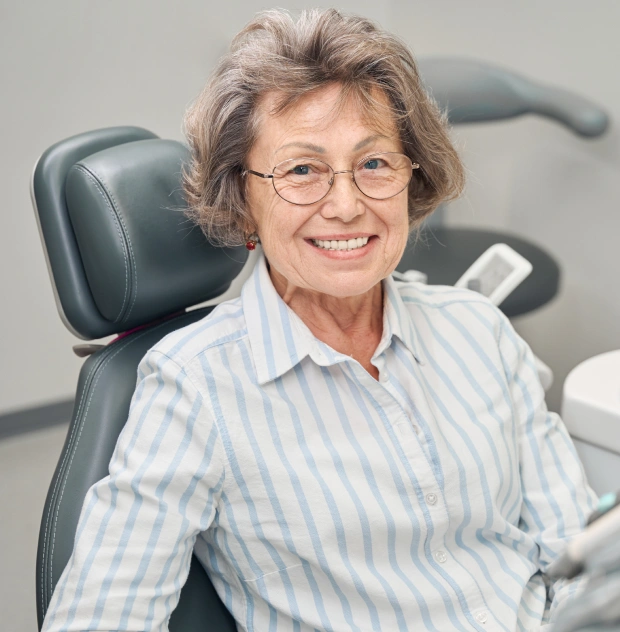 Senior patient receiving periodontal care
