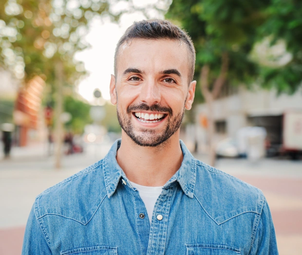 Smiling patient representing restorative dentistry