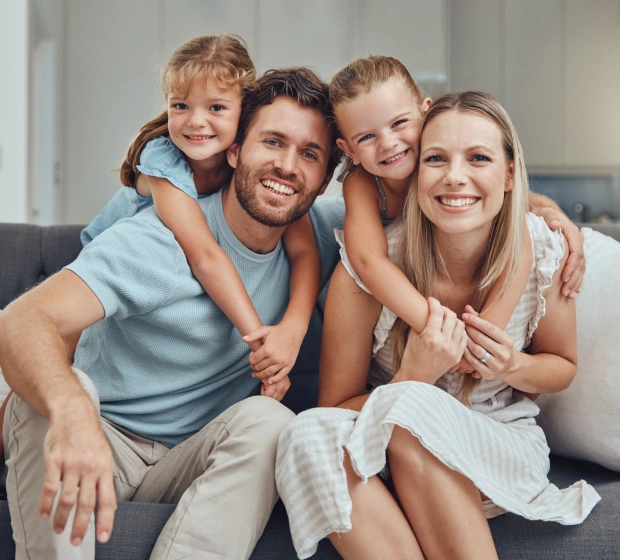 Happy family smiling at dental office
